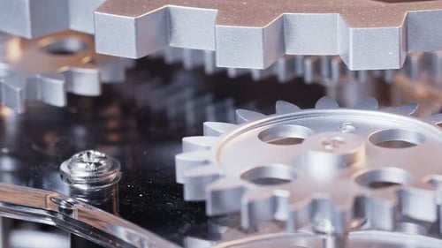 Rotating Silver Gears Close Up in a Machine