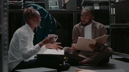 Two Private Investigators Examining Clues and Case Files
