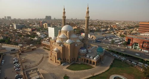 View of a large mosque with domes and lighthouses drone