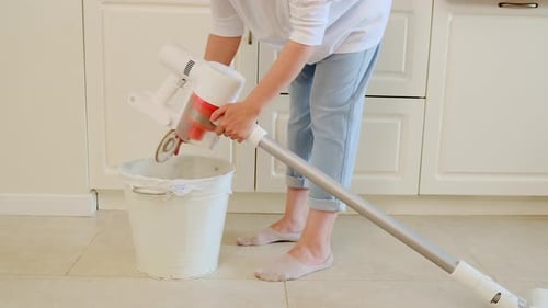 Adult Cleaning with Vacuum at Home