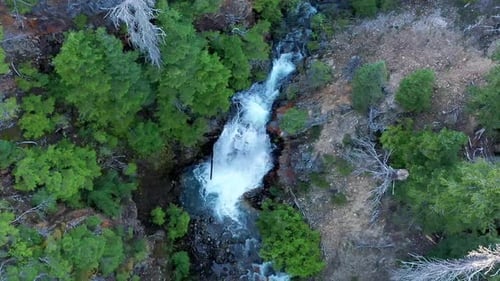 Close up of waterfall tilt up shot