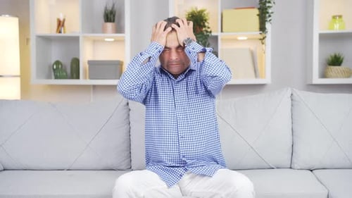 The man having a nervous breakdown is angry and does not feel well.
