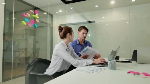 Young businesswoman talking during meeting in the office