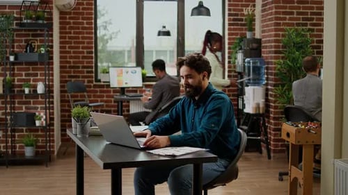Office Worker Talking on Remote Video Call Conference at Desk