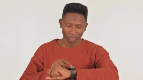Young Adult Using Smartwatch in Studio Setting