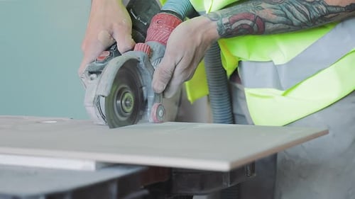 Man Works With Cutting Tool