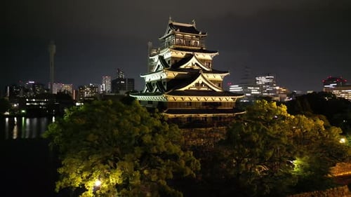 Aerial video of the Hiroshima skyline with Hiroshima Castle in Japan