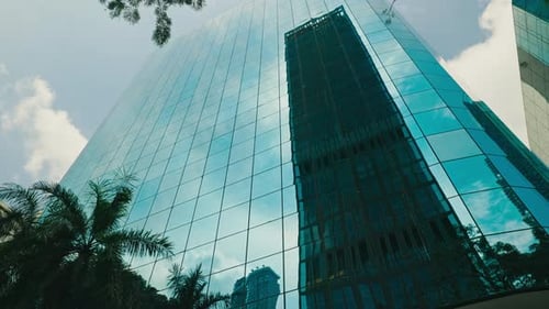 Skyscraper in the Glass Facade of Another Tall Building The Modern Architecture is Complemented By