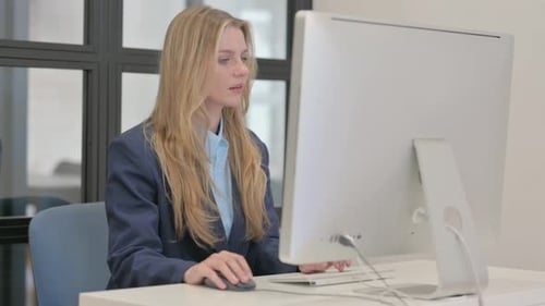 Woman Works at Computer in Bright Modern Office