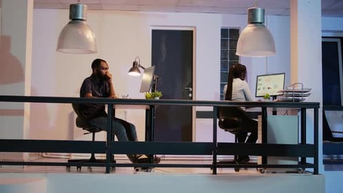 Company Employee Working on Computer to Plan Research Project