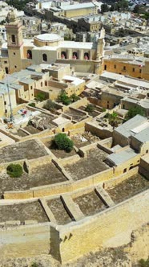 Aerial drone view of the Gozo island in Malta, in the Mediterranean Sea. Vertical vertical