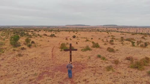 Aerial view of barren outback with a solitary man, Australia.