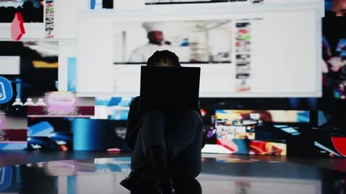 Teenager Procrastinating Online Browsing Websites on Laptop