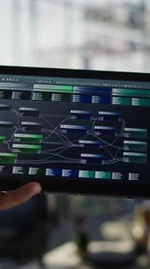 Vertical Video Close Up of Admin in Office Sing Tablet to Design Machine Learning Algorithms
