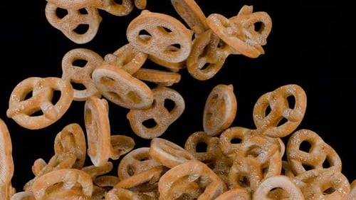 Realistic Pretzels Falling and Filling the Screen Animation