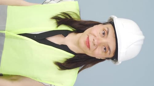 Vertical video of Engineer nodding to the camera.