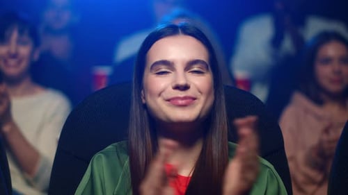 Woman Applauding at Movie Premiere