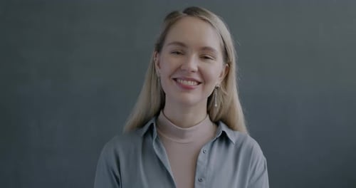 Smiling Woman Giving Thumbs Up Approval