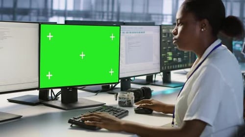 Data Center Technician Using Mockup PC Maintaining Company Network