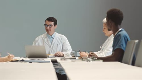 Medical Professionals Meeting at Conference Table
