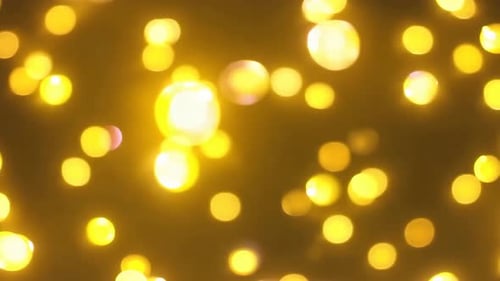 Floating Golden Bokeh Lights for Festive and Celebration Backgrounds