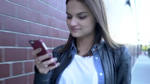 City Lifestyle Portrait of Attractive Female Person Chatting on Mobile Phone