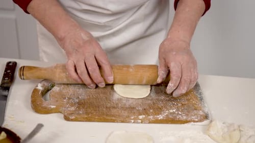 Dough Rolled on Wooden Board for Baking