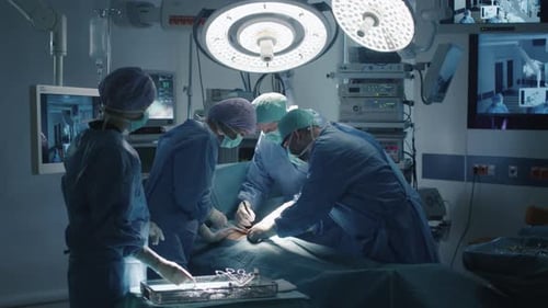 Surgeons Performing Operation in Operating Room