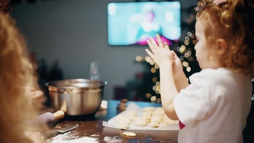 Family Baking Cookies Together at Christmas