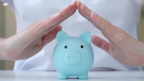 Woman Holding Hands Above Piggy Bank Savings Security and Deposit Insurance