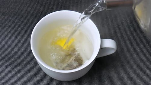 Pouring hot water in cup, green tea, lemon, drink, beverage, healthy, herbal tea, detox, antioxidant
