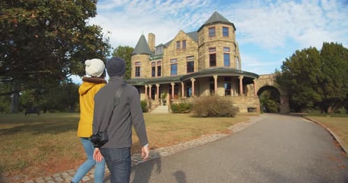 Couple strolling up to the historic maymont mansion estate in richmond Virginia