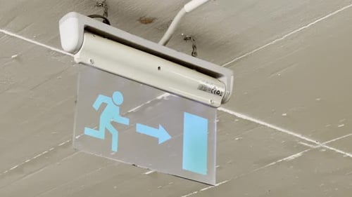 A close-up of a sign indicating "towards exit"