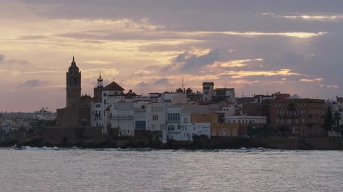 The City Skyline on Sunset Near the Water A Few Clouds on the Sky