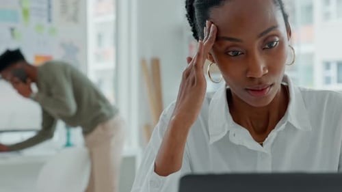 Woman Works At Laptop in Modern Office