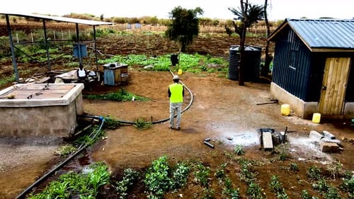 Rural agricultural farms in Kenya. Drone pilot land survey. Smart Agriculture technology.