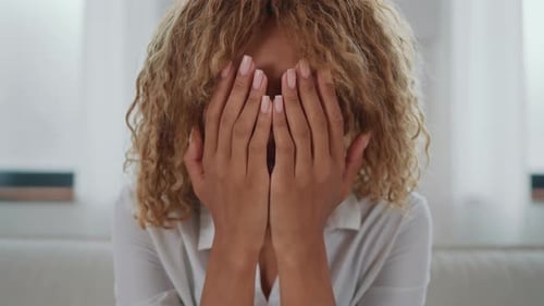 Smiling Young Woman Poses Indoors