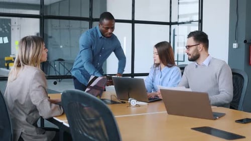 Business conception. Professional workers are in the modern office together.