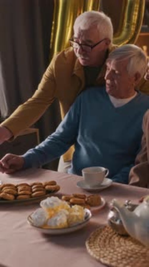 Seniors Celebrating Birthday with Phone at Home