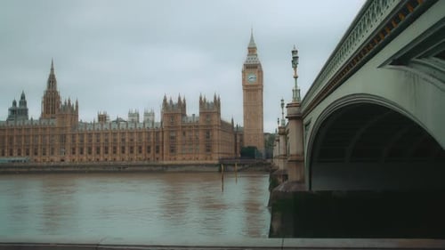 Palace of Westminster and Big Ben seen across The River Thames from under the bridge