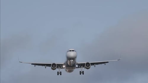 Airplane Flying Overhead to Land at Airport in Slow Motion
