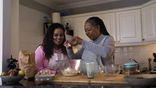 Two Women Baking Together in a Kitchen