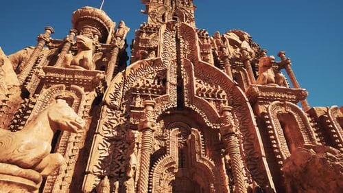 An Intricately Decorated Temple Wall Adorned with Statues