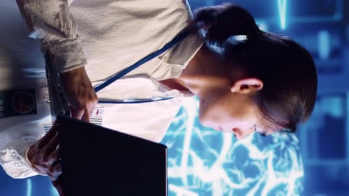 Vertical Video Admin Doing AI Simulation on Laptop