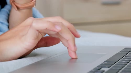 Hand Using Laptop Trackpad in Close-Up Shot