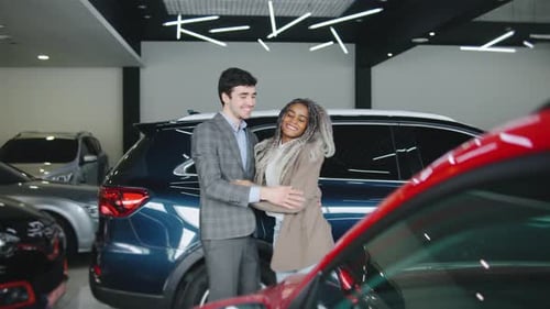 Woman Surprises Boyfriend with Car at Dealership