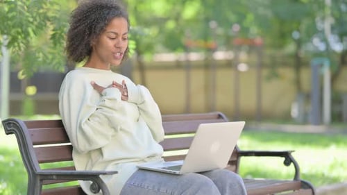 Woman on Laptop Video Call in Green Park