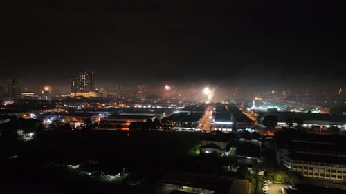Traditional festival loud explosions, dazzling city bright night lights