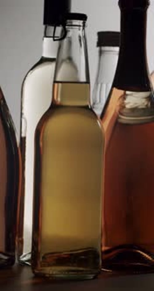 Static Shot of Various Bottles with Different Liquids