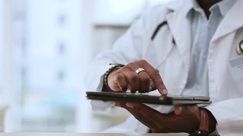 Tablet in hands of black man, doctor and technology, digital medical chart